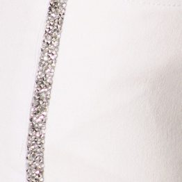 rhinestone jeans in white close up view of gems