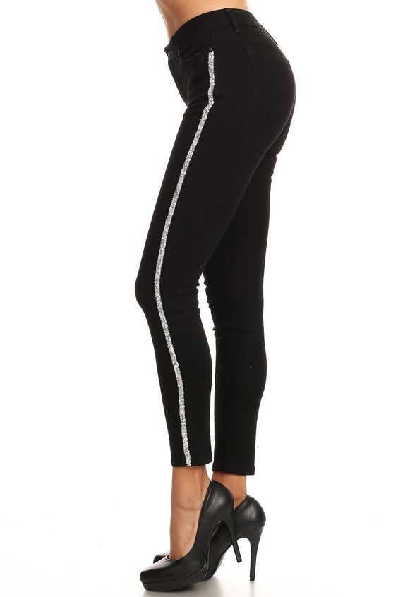 model showing side view of striped jeans in black with a rhinestone trim